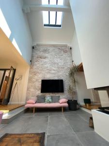 Część wypoczynkowa w obiekcie Maison de famille (piscine, jacuzzi et sauna)