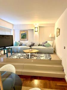 a living room with a couch and a table at Taormina Casa Liliana in Taormina