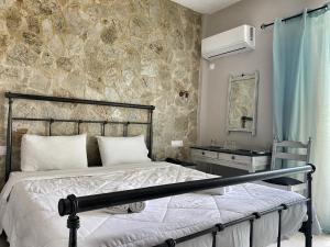Postel nebo postele na pokoji v ubytování Hotel Kastri