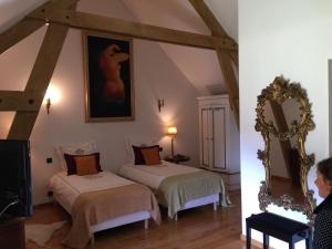 A bed or beds in a room at Maison In Normandie