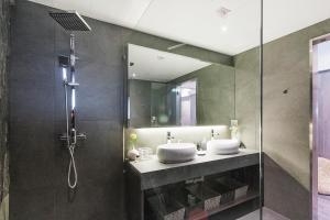 a bathroom with two sinks and a shower at L'Escale - by Maeva in Hong Kong +27 photos