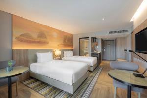 Кровать или кровати в номере Holiday Inn Resort Krabi Ao Nang Beach by IHG