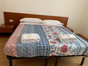 Postel nebo postele na pokoji v ubytování Roma paradise inn
