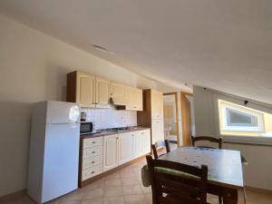 Kuchyň nebo kuchyňský kout v ubytování Casa Vacanze Cau