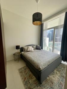 Postel nebo postele na pokoji v ubytování New Reva Hotel Apartment next Burj Khalifa + 28 fotografií