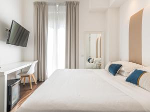 Posteľ alebo postele v izbe v ubytovaní PLEY Boutique Del Centro