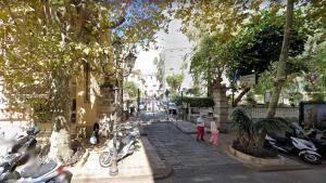 a group of motorcycles parked on a city street at Casa vacanze Nido al Mare in Sanremo