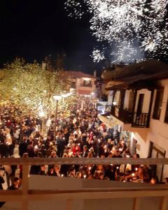 a crowd of people walking down a street at night at AGORA LUXURY LOFT in Agios Nikolaos