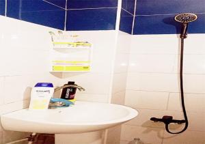 a bathroom with a sink and a shower at Modern Moroccan apartment near the beach in Safi in Safi