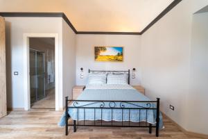 a bedroom with a bed in a room at Casale Il Terranova in Cortona +37 photos