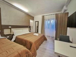 Postel nebo postele na pokoji v ubytování Kunesias B&B