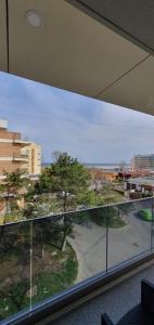 a large window in a building with a view of a street at Alecsa 1 Luxury Residence in Mamaia
