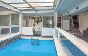 a swimming pool in the middle of a house at 4 Bedroom Awesome Home In Villars in Villars