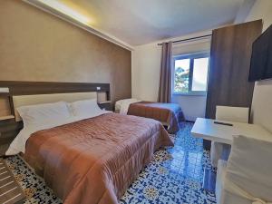 Postel nebo postele na pokoji v ubytování Kunesias B&B