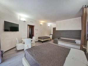 TV a/nebo společenská místnost v ubytování Kunesias B&B