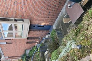 an overhead view of a brick building with stairs at Private Apartment in Pattensen