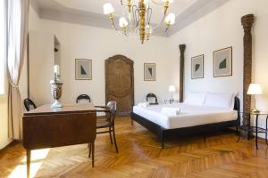Ένα ή περισσότερα κρεβάτια σε δωμάτιο στο Dimora Fossalta, a pochi passi da Piazza Maggiore