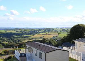 an aerial view of a house and a field at Tamar View Holiday Park in Gunnislake
