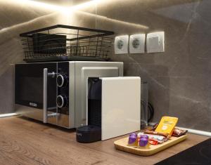 A kitchen or kitchenette at Blu & Marrone Suites-parking included