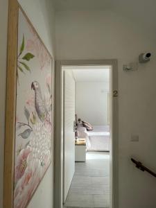 a hallway with a wall painting of a bedroom at La Dependance ApartHotel Scilla in Scilla