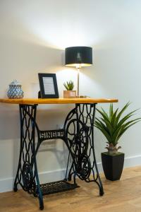 a black iron table with a lamp on top at FLH Santa Cruz Triplex with Terrace in Santa Cruz