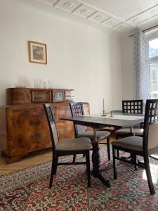 a dining room with a table and chairs at Apartamenty i pokoje przy sopockim molo in Sopot