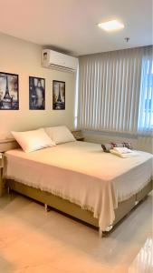 Cama ou camas em um quarto em América apart-hotel