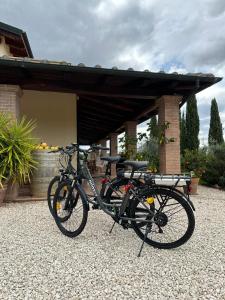 a bike parked in front of a building at Casale Terre Rosse in Saturnia