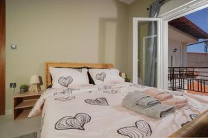 a bedroom with a bed with hearts drawn on it at Bridge Brazen in Edessa