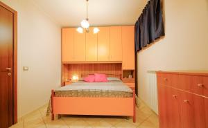 Ένα ή περισσότερα κρεβάτια σε δωμάτιο στο Poseidon 5 - Pineto Vacanza