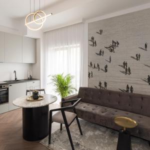 a living room with a couch and a table at Evo Residence Panoramic in Cluj-Napoca