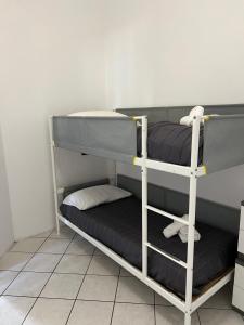 a room with two bunk beds in a room at Rho Fiera Apartment in Cornaredo