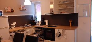 a kitchen with white cabinets and a counter top at Fewo Relax Family in Borken