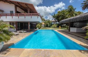 a swimming pool in the backyard of a villa at Duro Beach Garden Hotel in Cumbuco