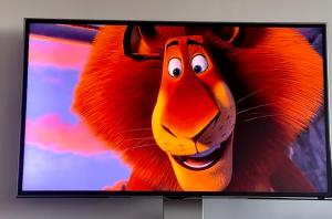 a television screen with a cartoonanimal at Unique view of Anfield stadium - Charming 2 bedroom apartment in Liverpool with parking in Liverpool