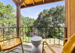 a screened in porch with a table and chairs at The Bygone in Wimberley
