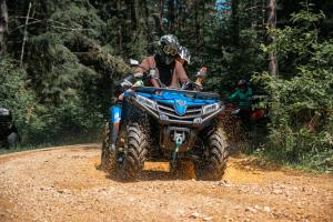 a person riding a atv on a dirt road at Hotel Mirjana & Rastoke in Slunj