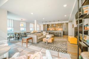 a living room with a couch and a table at Amazing 3BR Condo on Main with Hot Tub Steps to Lift in Park City