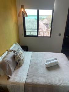 Postel nebo postele na pokoji v ubytování Hotel Diosa del Agua Bacalar