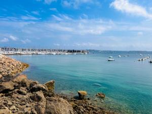 a view of a harbor with boats in the water at Appt Vue Mer Exceptionnelle Triple Expo - 70m 2ch - Rénové in Saint-Cast-le-Guildo