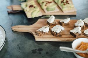 a wooden cutting board with pieces of food on it at La Vigne de Ramatuelle in Ramatuelle