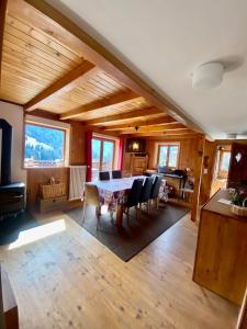 a dining room with a table and chairs in a house at Chalet Villars-Gryon 8pax Cosy in Gryon