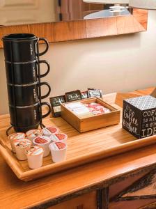 a wooden table with a tray with cups of food at Suncadia Lodge Studio Unit in Cle Elum