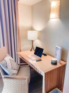 a room with a desk with a laptop and a chair at Suncadia Lodge Studio Unit in Cle Elum