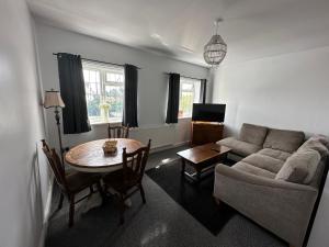 a living room with a couch and a table at Shepherds View, Flat 8 in Derby