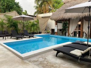 Bazén v ubytování Hotel Diosa del Agua Bacalar nebo v jeho okolí