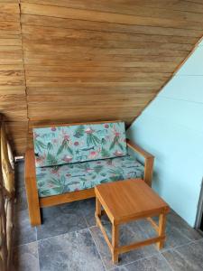 a couch and a table in a room at Hotel Calamari Baru in Playa Blanca