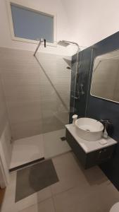 a bathroom with a toilet and a glass shower at Casetta San Giorgio in Vallata