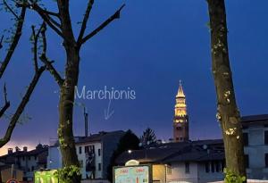 a building with a clock tower in the background at Marchionis in Cremona