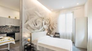 A bed or beds in a room at Casa vacanza il Gelsomino Magico